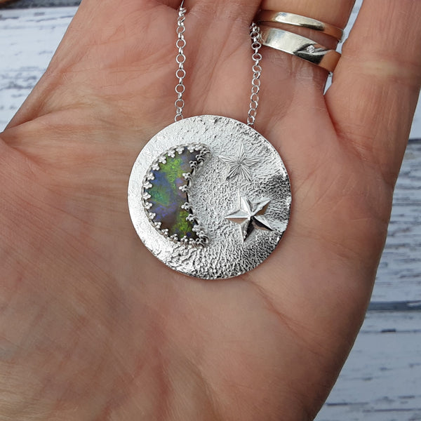 Cultured opal and sterling silver moon and stars pendant.